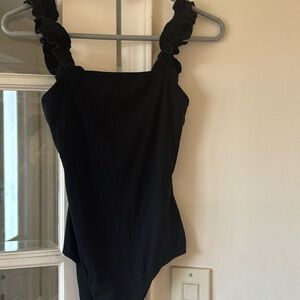 Le Lis black bodysuit with bottom, snap and ruffled straps